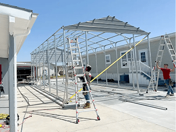 empty footpath amidst buildings against sky 1